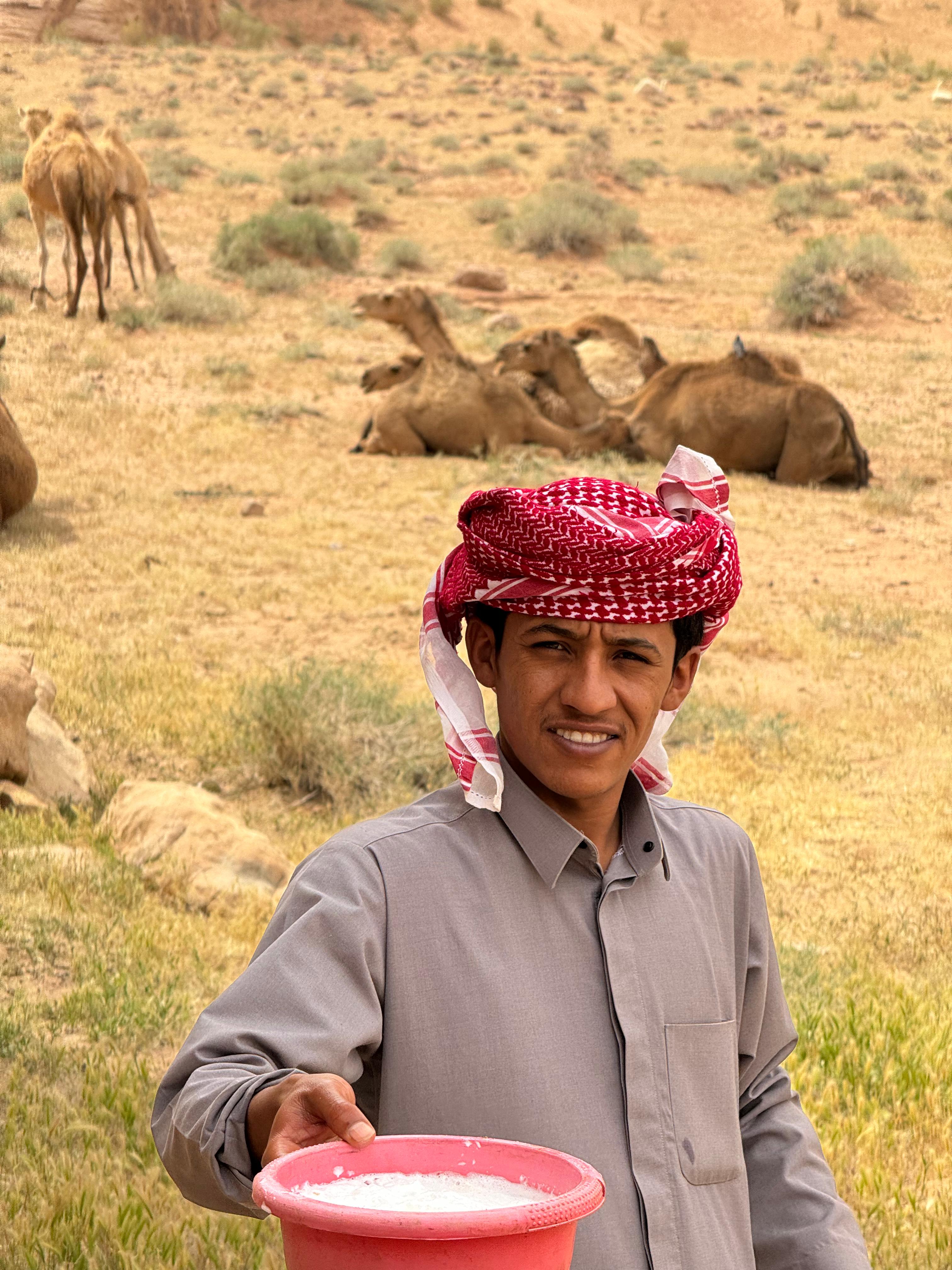Omar with camels in the background